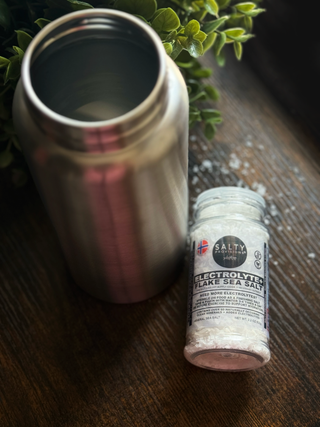 This is a product shot of the Salty Provisions Electrolyte+ Flake Sea Salt. Add it to your next glass of water to increase your hydration the pure and clean 'salty' way.